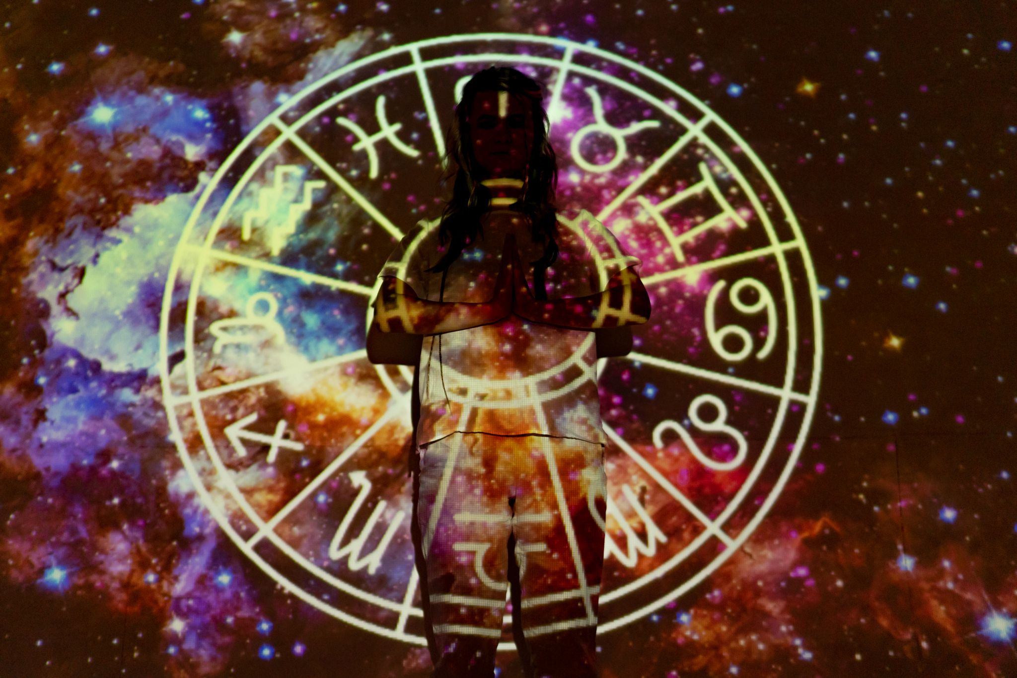 silhouette of a person with celestial astrology